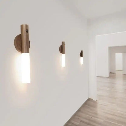 Rechargeable sensor wall light — three spaced along a bright hallway
